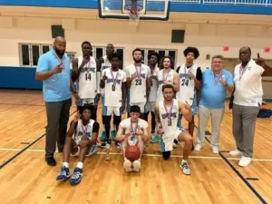A-youth-basketball-team-celebrates-with-medals-posing-in-a-gymnasium-showcasing-their-achievement-and-team-spirit-with-a-basketball