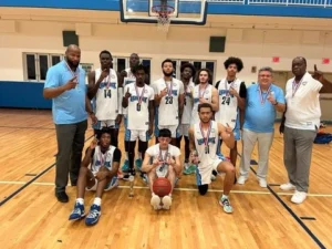 A youth basketball team celebrates with medals, posing in a gymnasium, showcasing their achievement and team spirit with a basketball